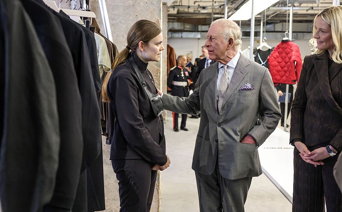 LONDON, ENGLAND - FEBRUARY 19: King Charles III sits next to CEO of the British Fashion Council Laura Weir on the front row for British-Nigerian designer Tolu Coker, the opening show of London fashion week on February 19, 2026 in London, England. (Photo by Richard Pohle - WPA Pool/Getty Images)