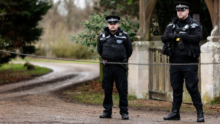Police officers next to a Waitrose van outside the Sandringham Estate, after Andrew Mountbatten-Windsor, younger brother of Britain's King Charles, formerly known as Prince Andrew, was released following arrest on suspicion of misconduct in public office on Thursday, after the U.S. Justice Department released more records tied to the late financier and convicted sex offender Jeffrey Epstein, in Norfolk, Britain, February 21, 2026. REUTERS/Benoit Tessier