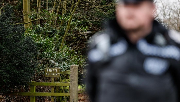 Police officers next to a Waitrose van outside the Sandringham Estate, after Andrew Mountbatten-Windsor, younger brother of Britain's King Charles, formerly known as Prince Andrew, was released following arrest on suspicion of misconduct in public office on Thursday, after the U.S. Justice Department released more records tied to the late financier and convicted sex offender Jeffrey Epstein, in Norfolk, Britain, February 21, 2026. REUTERS/Benoit Tessier