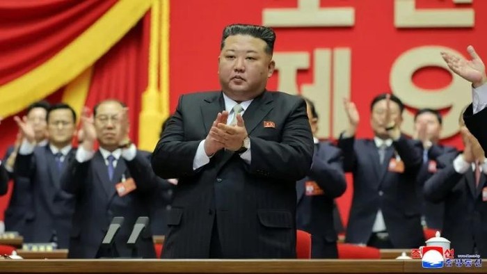 Delegates applaud as North Korean leader Kim Jong Un is re-elected as general secretary of the ruling Workers Party (STR/KCNA VIA KNS/AFP)
