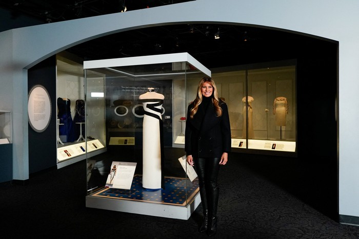 U.S. first lady Melania Trump stands next to her 2025 inaugural gown as it is displayed in the First Ladies Gallery at the Smithsonians National Museum of American History in Washington, D.C., U.S., February 20, 2026. REUTERS/Elizabeth Frantz