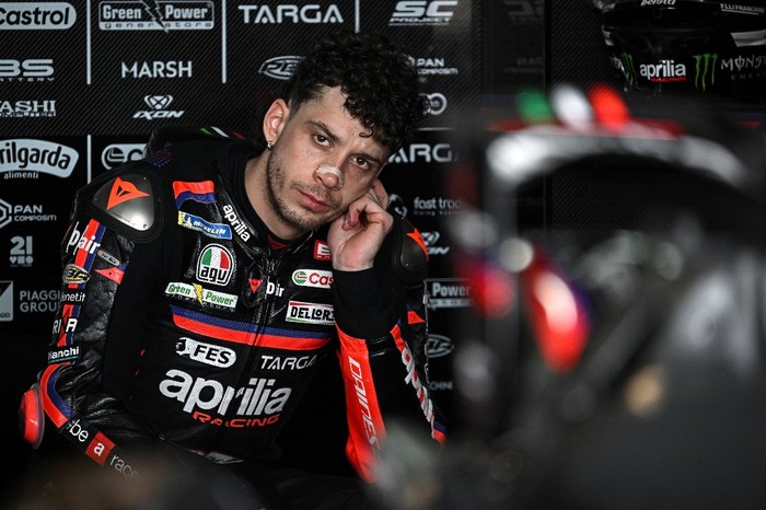 Aprilia Racings Italian rider Marco Bezzecchi sits in the garage during the second day of the 2026 MotoGP pre-season test at the Buriram International Circuit in Buriram on February 22, 2026. (Photo by Lillian SUWANRUMPHA / AFP)
