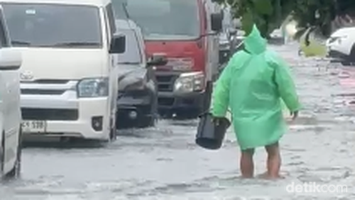 Kemacetan panjang di Jalan Bypass Ngurah Rai, Denpasar, akibat banjir, Selasa (24/2/2026).
