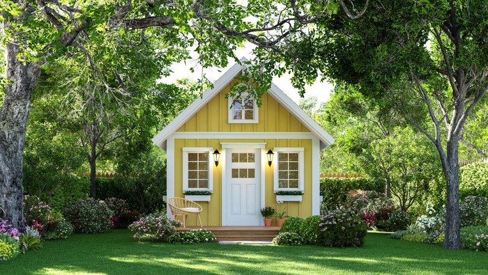 Cute tiny yellow house on green lawn 3d render Surrounded by nature.