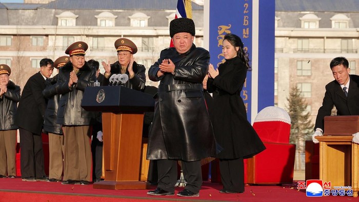 North Korean leader Kim Jong Un and his daughter Kim Ju Ae applaud during the completion ceremony of a new housing district in Pyongyang for families of troops who died in overseas military operations, state media KCNA said, in this picture released by North Korea's official Korean Central News Agency, February 16, 2026.  KCNA via REUTERS    ATTENTION EDITORS - THIS IMAGE WAS PROVIDED BY A THIRD PARTY. REUTERS IS UNABLE TO INDEPENDENTLY VERIFY THIS IMAGE. NO THIRD PARTY SALES. SOUTH KOREA OUT. NO COMMERCIAL OR EDITORIAL SALES IN SOUTH KOREA.