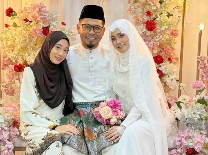 Muhammad  Azizi Zakaria bersama dua isteri tercinta, Shuhadah Jaafar (duduk kiri) dan Nor Azura Mohd Azmin (duduk kanan).