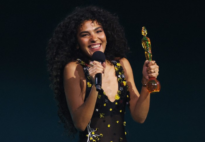 Olivia Dean accepts an award for the Album of the Year, during the BRIT Awards at the Co-op Live Arena, in Manchester, Britain, February 28, 2026. REUTERS/Isabel Infantes