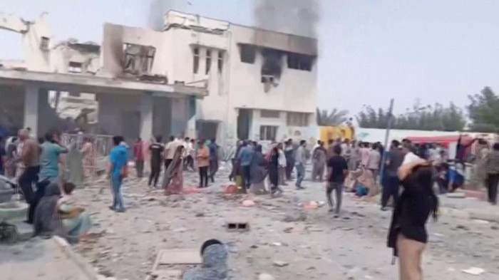 Black smoke rises from a destroyed building at a school where, as the state media reports, several people were killed in an Israeli airstrike, following strikes by the United States and Israel against Iran, in Minab, Iran in this screengrab obtained 