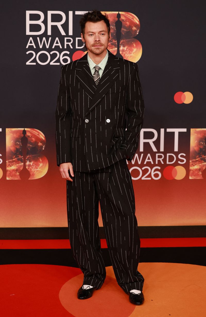 Harry Styles poses on the red carpet during for the BRIT Awards at the Co-op Live Arena, in Manchester, Britain, February 28, 2026. REUTERS/Temilade Adelaja