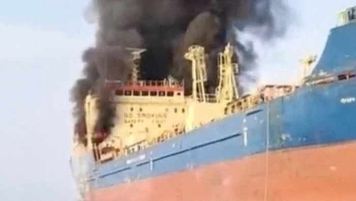 Smoke billows from an oil tanker under U.S. sanctions, that was hit off Omans Musandam peninsula, in this screen grab from a video obtained by REUTERS on March 1, 2026. THIS IMAGE HAS BEEN SUPPLIED BY A THIRD PARTY  VERIFICATION Identity of the vess