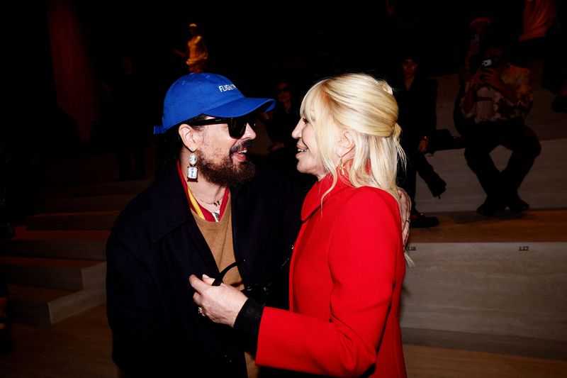 Fashion designers Donatella Versace and Alessandro Michele react ahead of a catwalk show for Gucci's Fall/Winter 2026/2027 collection during Fashion Week in Milan, Italy, February 27, 2026. REUTERS/Alessandro Garofalo