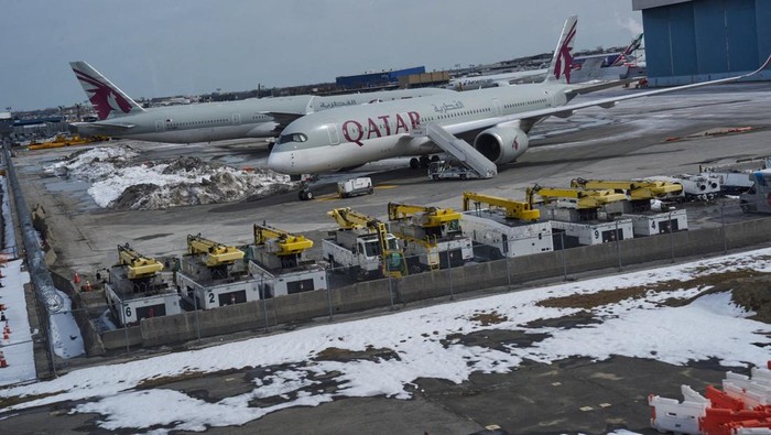 Aircraft operated by Qatar Airways parked at John F. Kennedy (JFK) International Airport, amid the U.S.-Israel conflict with Iran, in New York City, U.S., March 2, 2026. REUTERS/Bing Guan     TPX IMAGES OF THE DAY