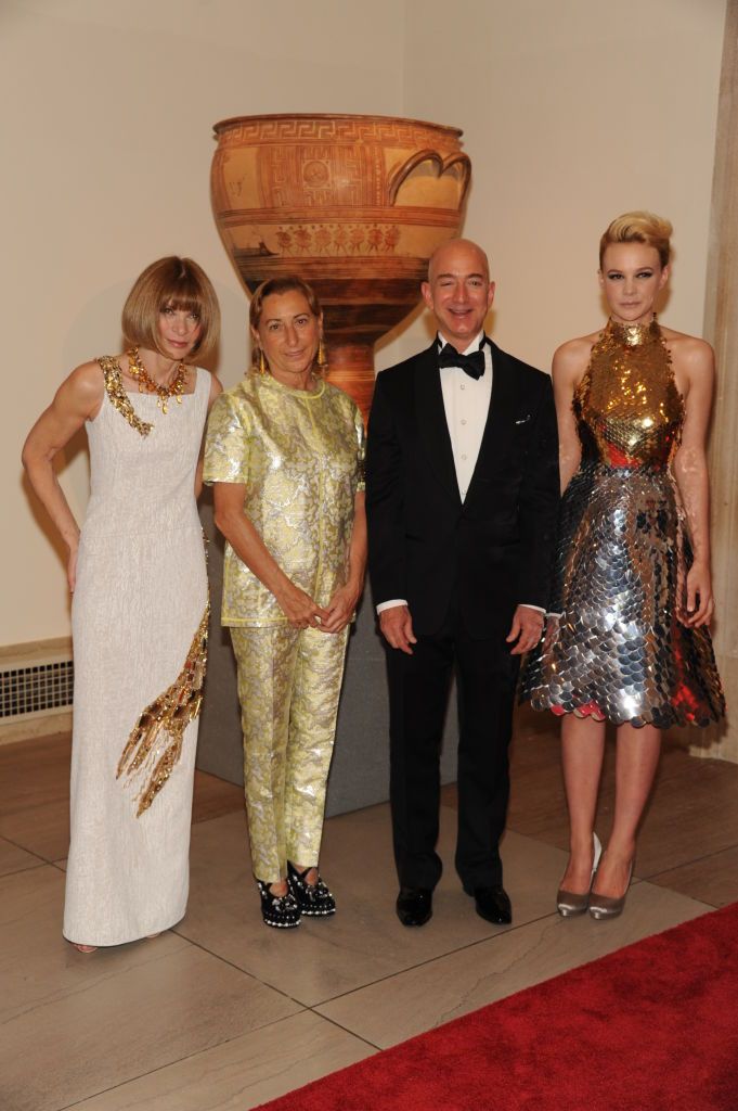 (L-R) Anna Wintour, Miuccia Prada, Jeff Bezos and Carey Mulligan attend the Metropolitan Museum of Artâ€™s 2012 Costume Institute Gala featuring the debut of â€œSchiaparelli and Prada: Impossible Conversations.â€� All wear Prada. (Photo by Fairchild Archive/Penske Media via Getty Images)