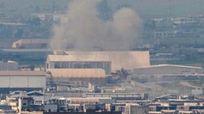 Smoke rises after an explosion near Erbil International Airport in Erbil on March 6, 2026. Explosions sounded on March 6 near Erbil airport in Iraqs autonomous Kurdistan region and an attack forced a US-run oil field to shut production. (Photo by Oz