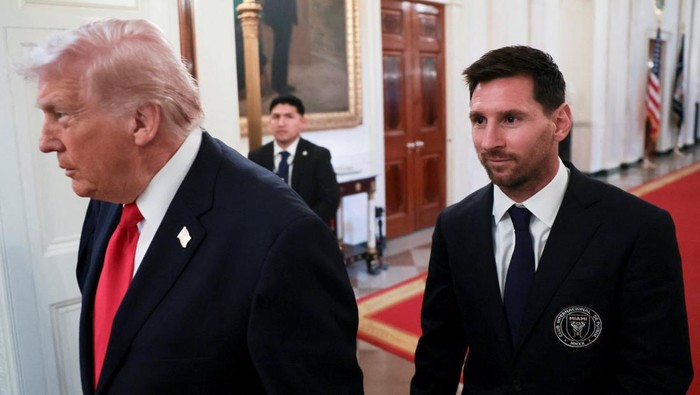 U.S. President Donald Trump arrives with Inter Miami CF captain Lionel Messi on the day he honors reigning Major League Soccer (MLS) champion Inter Miami CF players and team officials with an event in the East Room of the White House in Washington, D.C., U.S., March 5, 2026. REUTERS/Jonathan Ernst