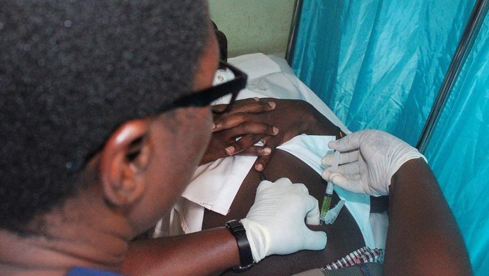 A medical clinician administers a dose of the long-acting injectable HIV pre-exposure prophylaxis (PrEP), Lenacapavir injection, to a client, as an HIV prevention drug taken twice a year to reduce the risk of HIV transmission, during its launch in th