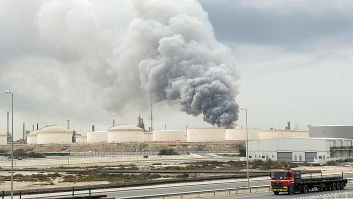 Smoke rises following a strike on the Bapco Oil Refinery, amid the U.S.-Israeli conflict with Iran, on Sitra Island Bahrain, March 9, 2026. REUTERS/Stringer      TPX IMAGES OF THE DAY