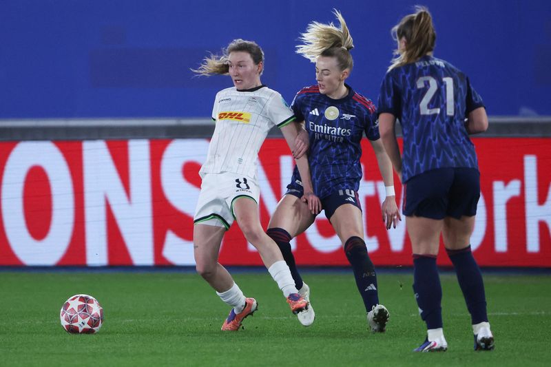 Soccer Football - UEFA Women's Champions League -  Round of 16 - First Leg - OH Leuven v Arsenal - Den Dreef, Leuven, Belgium - February 11, 2026 OH Leuven's Sara Pusztai in action with Arsenal's Chloe Kelly REUTERS/Omar Havana
