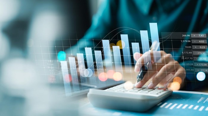 Businesswoman use laptop and calculator analyzing company growth, future business growth arrow graph, development to achieve goals, business outlook, financial data for long term investment.