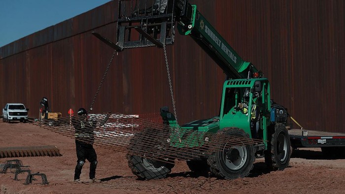 CIUDAD JUAREZ, MEXICO - MARCH 11: Construction continues on a new section of the border wall between Santa Teresa, New Mexico, and Ciudad Juarez, Mexico, on March 11, 2026. Workers install cement bases and steel rods as part of the ongoing project to reinforce the barrier along the international border. (Photo by Christian Torres/Anadolu via Getty Images)