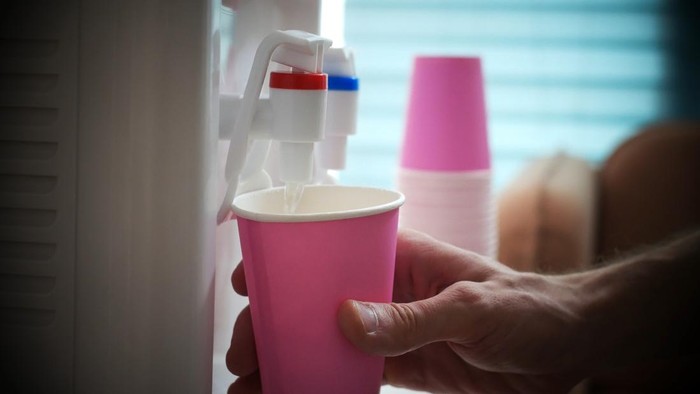 A water cooler dispenser in the office