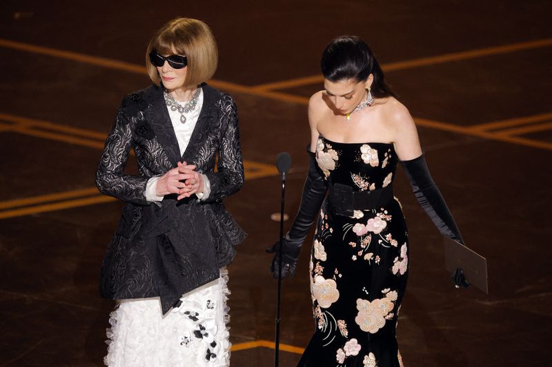 Anna Wintour and Anne Hathaway stand onstage during the Oscars show at the 98th Academy Awards in Hollywood, Los Angeles, California, U.S., March 15, 2026. REUTERS/Mike Blake