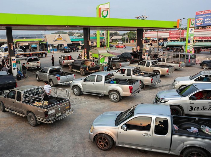 Drivers queue in traffic as they wait to refuel their vehicles outside a fuel station, before Thailands diesel price freeze expires on Monday, amid concerns about rising fuel prices linked to the U.S.-Israel conflict with Iran, in Nakhon Pathom prov