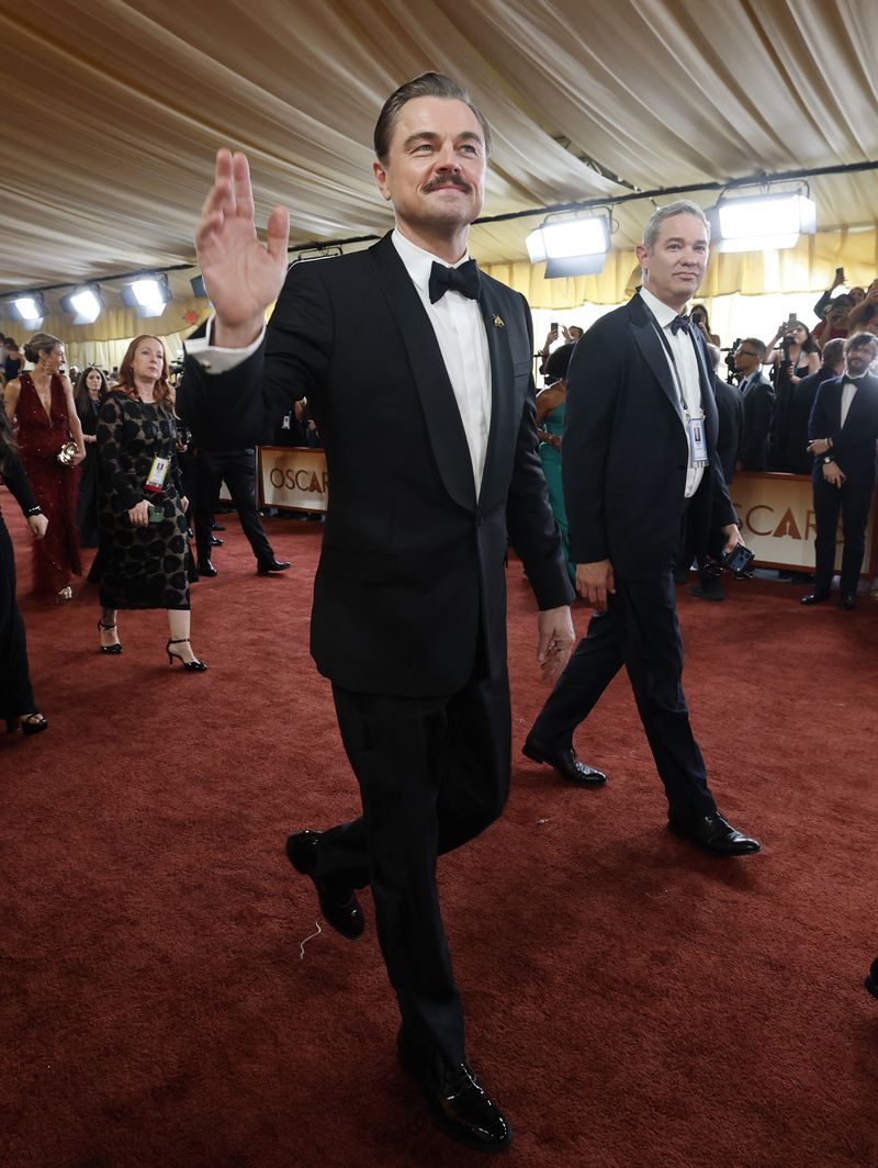 Leonardo DiCaprio walks down the red carpet during the Oscars arrivals at the 98th Academy Awards in Hollywood, Los Angeles, California, U.S., March 15, 2026.    REUTERS/Carlos Barria