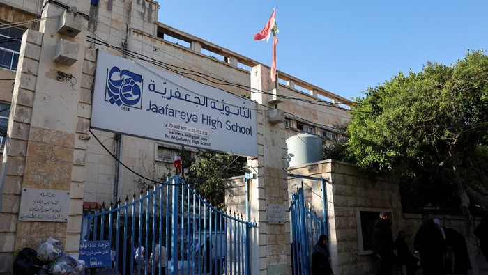 Displaced girls from Majdal Zoun in southern Lebanon pose for a photograph inside Al-Jaafareya High School, which is being used as a shelter for displaced families from Majdal Zoun in southern Lebanon, following an escalation between Hezbollah and Israel amid the U.S.-Israeli conflict with Iran, after they arrived in Tyre, Lebanon, March 17, 2026. REUTERS/Amr Abdallah Dalsh