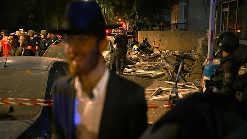 RAMAT GAN, ISRAEL - MARCH 18: Emergency workers respond to a ballistic missile attack in which a couple in their 70s were killed, according to published reports, on March 18, 2026 in the Tel Aviv suburb of Ramat Gan, Israel.  Iran has continued firing waves of drones and missiles at Israel after the United States and Israel launched a joint attack on Iran early on February 28th. (Photo by Alexi J. Rosenfeld/Getty Images)