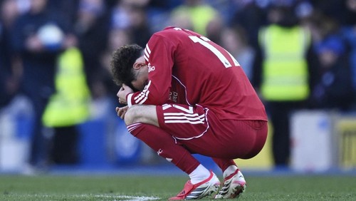 Soccer Football - Premier League - Brighton & Hove Albion v Liverpool - The American Express Community Stadium, Brighton, Britain - March 21, 2026 Liverpools Curtis Jones looks dejected after the match REUTERS/Tony O Brien EDITORIAL USE ONLY. NO USE WITH UNAUTHORIZED AUDIO, VIDEO, DATA, FIXTURE LISTS, CLUB/LEAGUE LOGOS OR LIVE SERVICES. ONLINE IN-MATCH USE LIMITED TO 120 IMAGES, NO VIDEO EMULATION. NO USE IN BETTING, GAMES OR SINGLE CLUB/LEAGUE/PLAYER PUBLICATIONS. PLEASE CONTACT YOUR ACCOUNT REPRESENTATIVE FOR FURTHER DETAILS..