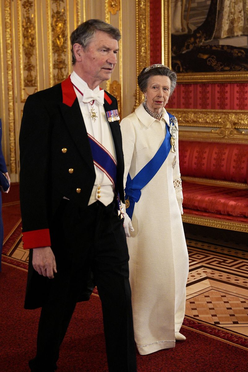 Vice Admiral Sir Tim Laurence and Britain's Princess Anne, Princess Royal arrive to attend a State Banquet in St George's Hall, at Windsor Castle, March 18, 2026.    Aaron Chown/Pool via REUTERS