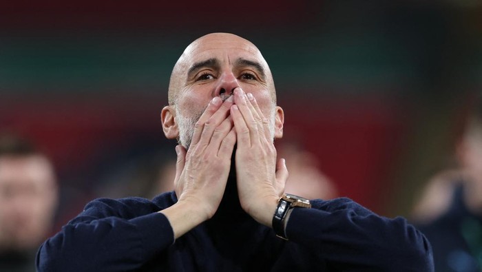 Soccer Football - Carabao Cup - Final - Arsenal v Manchester City - Wembley Stadium, London, Britain - March 22, 2026 Manchester City manager Pep Guardiola celebrates winning the Carabao Cup Action Images via Reuters/Paul Childs EDITORIAL USE ONLY. NO USE WITH UNAUTHORIZED AUDIO, VIDEO, DATA, FIXTURE LISTS, CLUB/LEAGUE LOGOS OR LIVE SERVICES. ONLINE IN-MATCH USE LIMITED TO 120 IMAGES, NO VIDEO EMULATION. NO USE IN BETTING, GAMES OR SINGLE CLUB/LEAGUE/PLAYER PUBLICATIONS. PLEASE CONTACT YOUR ACCOUNT REPRESENTATIVE FOR FURTHER DETAILS..