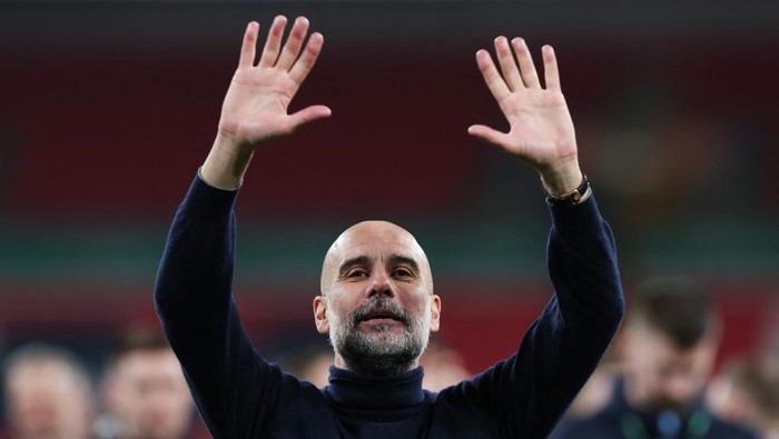 Soccer Football - Carabao Cup - Final - Arsenal v Manchester City - Wembley Stadium, London, Britain - March 22, 2026 Manchester City manager Pep Guardiola celebrates winning the Carabao Cup Action Images via Reuters/Paul Childs EDITORIAL USE ONLY. N