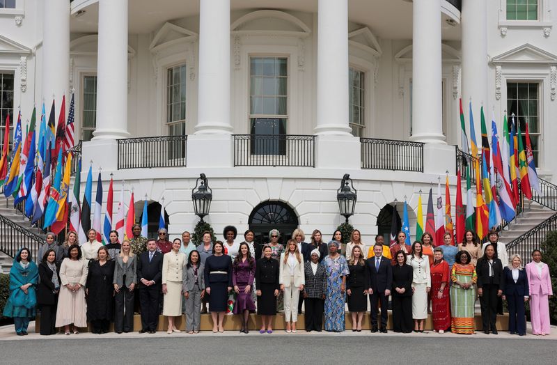 Kosovar first gentleman Prindon Sadriu, Sierra Leonean first lady Fatima Bio, Polish first lady Marta Nawrocka, Brigitte Macron, the wife of French President Emmanuel Macron, U.S. first lady Melania Trump, Morocco's Princess Lalla Hasnaa, The United Arab Emirates' Sheikha Alyazia bint Saif Al Nahyan, Panamanian first lady Maricel Cohen de Mulino and Malawian first lady Gertrude Mutharika pose for a family photo following a roundtable event hosted by U.S. first lady on the second day of the inaugural Fostering the Future Together Global Coalition Summit at the White House in Washington, D.C., U.S., March 25, 2026. REUTERS/Kylie Cooper