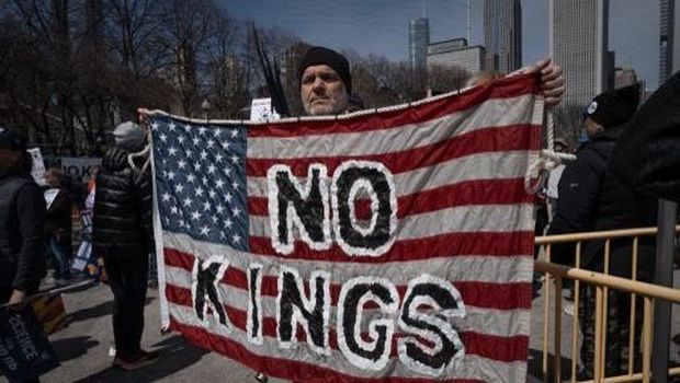 CHICAGO, ILLINOIS - MARCH 28: Demonstrators gather downtown in Grant Park to protest policies of the Trump administration by participating in a No Kings rally and march on March 28, 2026 in Chicago, Illinois. This is the third nationwide 