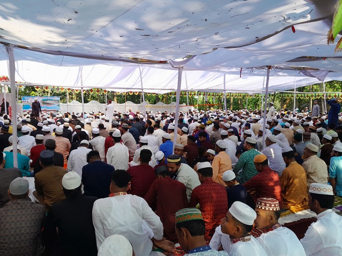 Cumilla, Bangladesh - April 22, 2023: Moment of Muslims performing the communal Eid prayer in Cumilla, Bangladesh. Lots of people attend in religious programme. Shahi Eidgah to pray for welfare, happiness, peace, and prosperity.