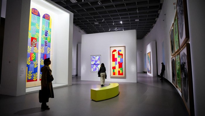 A woman looks at paintings by painter Henri Matisse (1869-1954) during a press visit of the exhibition 