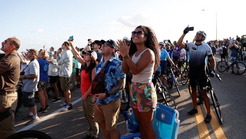 People gather on the day of the launch of the next-generation moon rocket, the Space Launch System (SLS) rocket and the Orion crew capsule, part of NASA's Artemis II lunar flyby mission, from NASA's Kennedy Space Center, in Titusville, Florida, U.S., April 1, 2026. REUTERS/Marco Bello