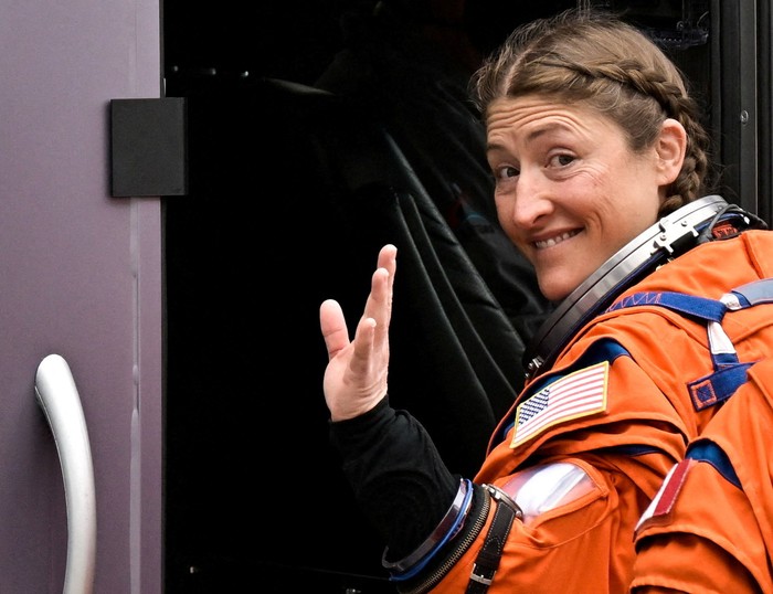 NASA astronaut Christina Koch waves as she boards the astronaut van with the crew of the Artemis II launch mission to fly by the moon, NASA astronauts Reid Wiseman and Victor Glover and CSA (Canadian Space Agency) astronaut Jeremy Hansen, before heading to launch pad 39B at the Kennedy Space Center in Cape Canaveral, Florida, U.S. April 1, 2026.  REUTERS/Steve Nesius       TPX IMAGES OF THE DAY