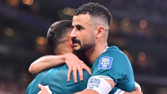 GUADALUPE, MEXICO - MARCH 31: Ali Ibrahim Al-Hamadi of Irak celebrates with teammate Aymen Hussein after scoring his teams first goal during the FIFA World Cup 2026 Play-Off tournament final match between Irak and Bolivia at Estadio Monterrey on March 31, 2026 in Guadalupe, Mexico.   Azael Rodriguez/Getty Images/AFP (Photo by Azael Rodriguez / GETTY IMAGES NORTH AMERICA / Getty Images via AFP)