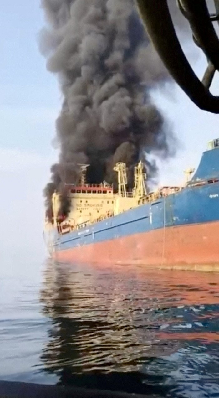 FILE PHOTO: Smoke billows from an oil tanker under U.S. sanctions, that was hit off Oman's Musandam peninsula, in this screen grab from a video obtained by REUTERS on March 1, 2026. THIS IMAGE HAS BEEN SUPPLIED BY A THIRD PARTY.  VERIFICATION: Identity of the vessel confirmed as Skylight by its deck shape, paint, and signage, which matched file imagery. Exact time not verified.  However, Oman's maritime security center said that Skylight was attacked about five nautical miles off Oman's Musandam on Sunday (March 1).  Ship tracking data puts the vessel off the coast of Oman on Sunday (March 1). REFILE - UPDATING VERIFICATION LINES/File Photo