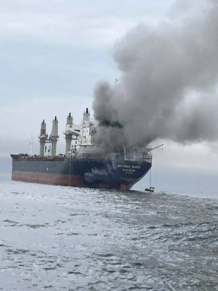 The Thailand-flagged cargo ship Mayuree Naree engulfed in black smoke in the Strait of Hormuz, March 11, 2026.  ROYAL THAI NAVY/Handout via REUTERS    THIS IMAGE HAS BEEN SUPPLIED BY A THIRD PARTY. NO RESALES. NO ARCHIVES. MANDATORY CREDIT  VERIFICATION: - Identity of the vessel confirmed as Thai-flagged bulk carrier Mayuree Naree from IMO number, hull and superstructure seen in the images which matched file imagery of the vessel    - Location confirmed as off north coast of Oman, in Strait of Hormuz, from ship tracking data from captured March 11 - Royal Thai Navy and United Kingdom Maritime Trade Operations reported that a cargo vessel was hit by an unknown projectile in the Strait of Hormuz on March 11 - Thailand-flagged bulk carrier Mayuree Naree was targeted and damaged approximately 11 nautical miles north of Oman, two maritime security sources said.