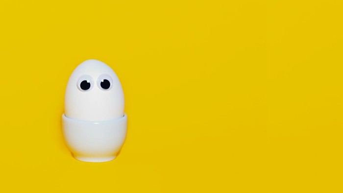 Creative easter banner concept. Happy easter. White chicken egg with eyes. Copy space.