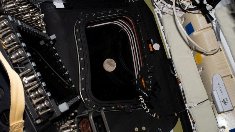A view of the Moon and the Earth as the Artemis II mission's Orion spacecraft approaches to reach its furthest distance from Earth, in this screengrab taken from a livestream video on April 6, 2026. NASA/Handout via REUTERS    THIS IMAGE HAS BEEN SUPPLIED BY A THIRD PARTY.
