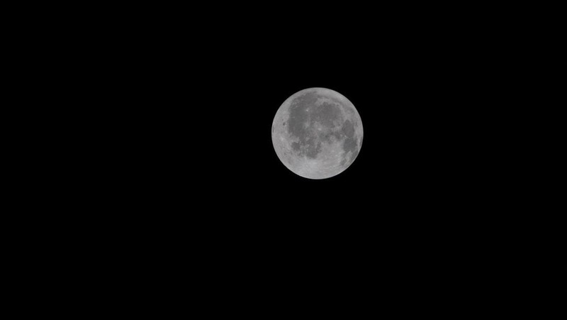 A view of the Moon and the Earth as the Artemis II mission's Orion spacecraft approaches to reach its furthest distance from Earth, in this screengrab taken from a livestream video on April 6, 2026. NASA/Handout via REUTERS    THIS IMAGE HAS BEEN SUPPLIED BY A THIRD PARTY.