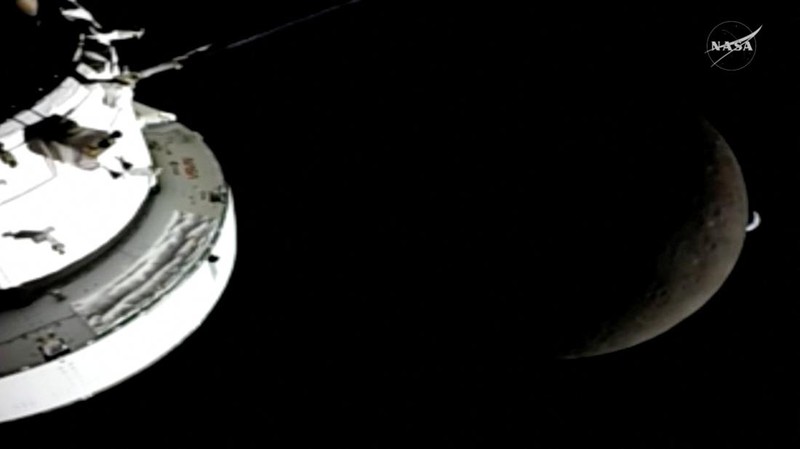 A view of the Moon and the Earth as the Artemis II mission's Orion spacecraft approaches to reach its furthest distance from Earth, in this screengrab taken from a livestream video on April 6, 2026. NASA/Handout via REUTERS    THIS IMAGE HAS BEEN SUPPLIED BY A THIRD PARTY.