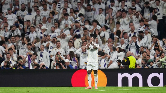 MADRID, SPAIN - APRIL 07: Vinicius Junior of Real Madrid reacts after a missed chance during the UEFA Champions League 2025/26 Quarter-Final First Leg match between Real Madrid CF and FC Bayern München at Estadio Santiago Bernabeu on April 07, 2026 