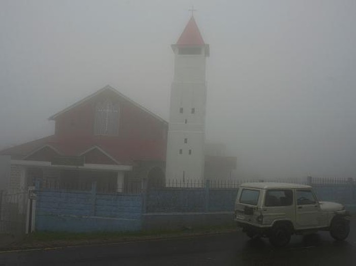 SHILLONGIND, SHILLONG, MEGHALAYA, INDIA - 2016/05/16: Taxi drivers talk to one another in the mist covered Cherapunjee in Meghalaya. Cherrapunjee or Charrapunji is a subdivisional town in the East Khasi Hills district in Meghalaya. It is credited as being the wettest place on Earth, although nearby Mawsynram currently holds that record. Cherrapunji still holds the all-time record for the most rainfall in a calendar month and in a year. (Photo by Subhendu Sarkar/LightRocket via Getty Images)