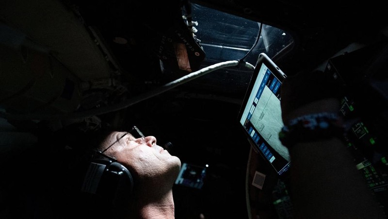 The NASA Artemis II crew, Mission Specialist Christina Koch, Mission Specialist Jeremy Hansen, Commander Reid Wiseman, and Pilot Victor Glover, pose for a group photo inside the Orion spacecraft on their way home following a flyby of the far side of the Moon on April 6, 2026. NASA/Handout via REUTERS THIS IMAGE HAS BEEN SUPPLIED BY A THIRD PARTY. REFILE - CORRECTING DATE FROM 